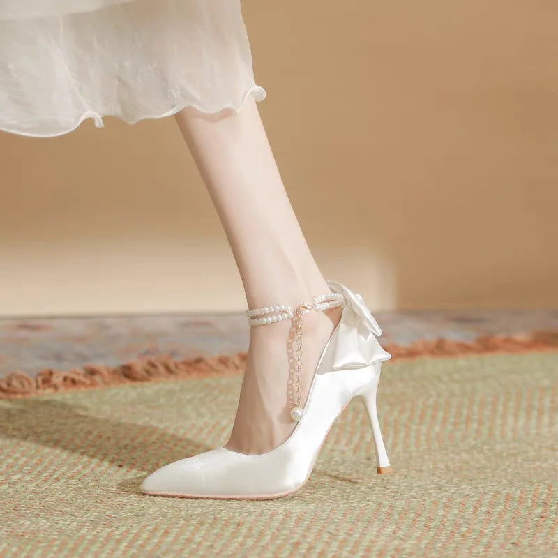RBB Elegant White Stiletto Heels with Pearl Buckle & Satin Bow – Bridal & Party Pumps (Size 35–40)
