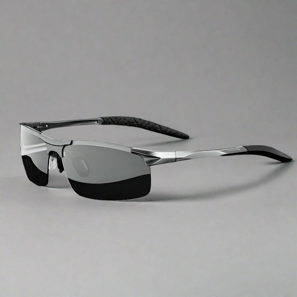 Sunglasses with photochromic properties, case, and box on a white background