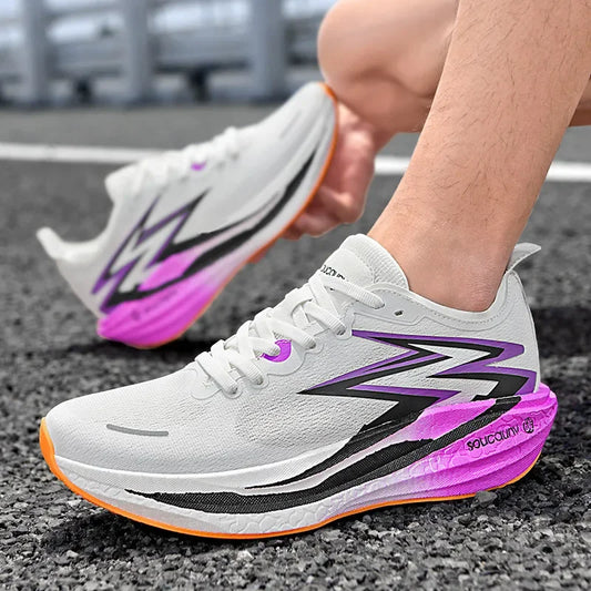 White running shoes with purple and black accents on a road.