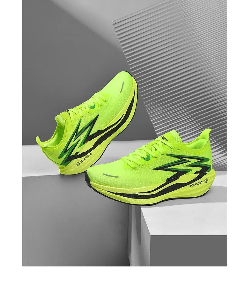 Bright green running shoes with black accents on a gray surface.