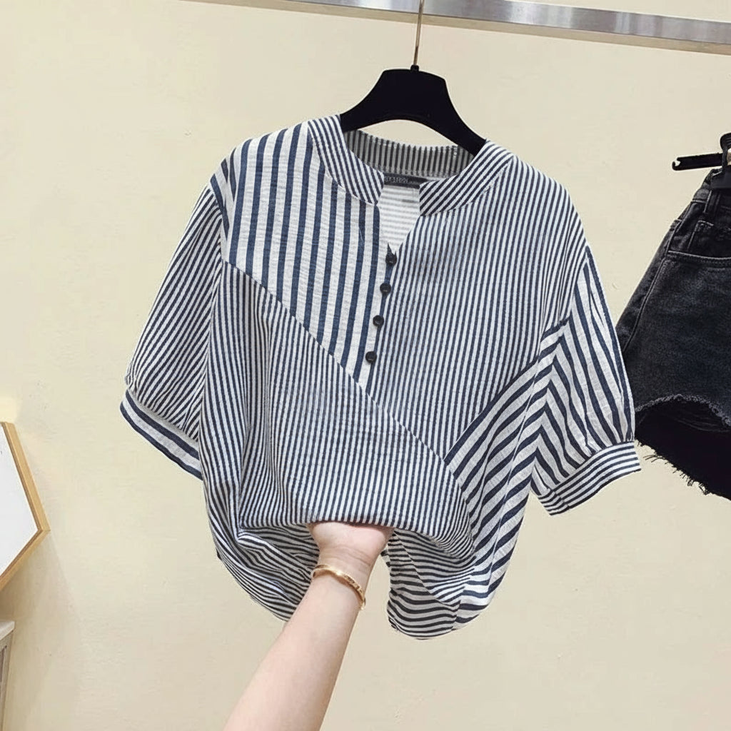 Striped shirt on a hanger with ZANZEA branding