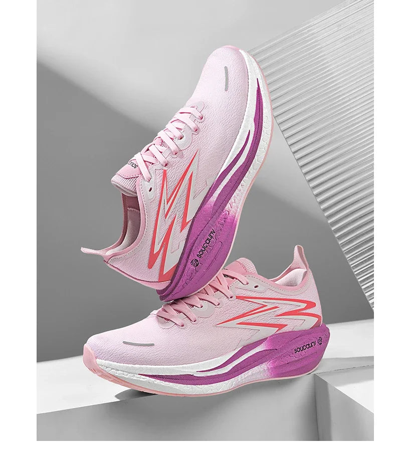 Pink and purple running shoes with white sole on a gray background