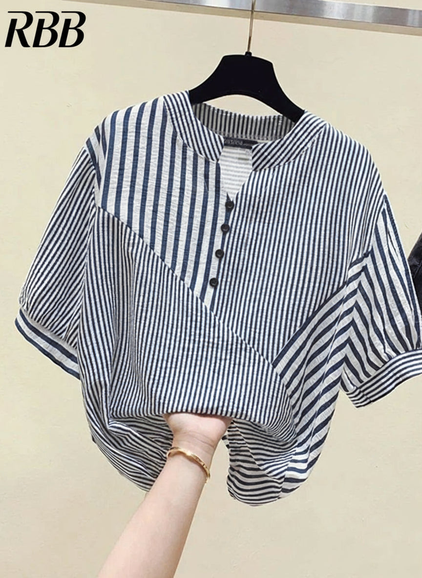 Black and white striped shirt on a hanger with ZANZEA branding.